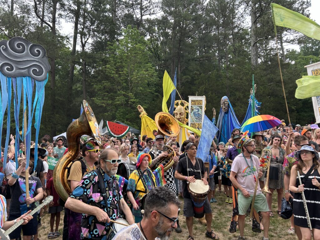 Strutters lead the People's Parade at Shakori Hills Grassroots Festival.