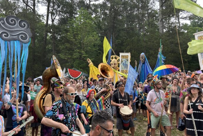 Strutters lead the People's Parade at Shakori Hills Grassroots Festival.