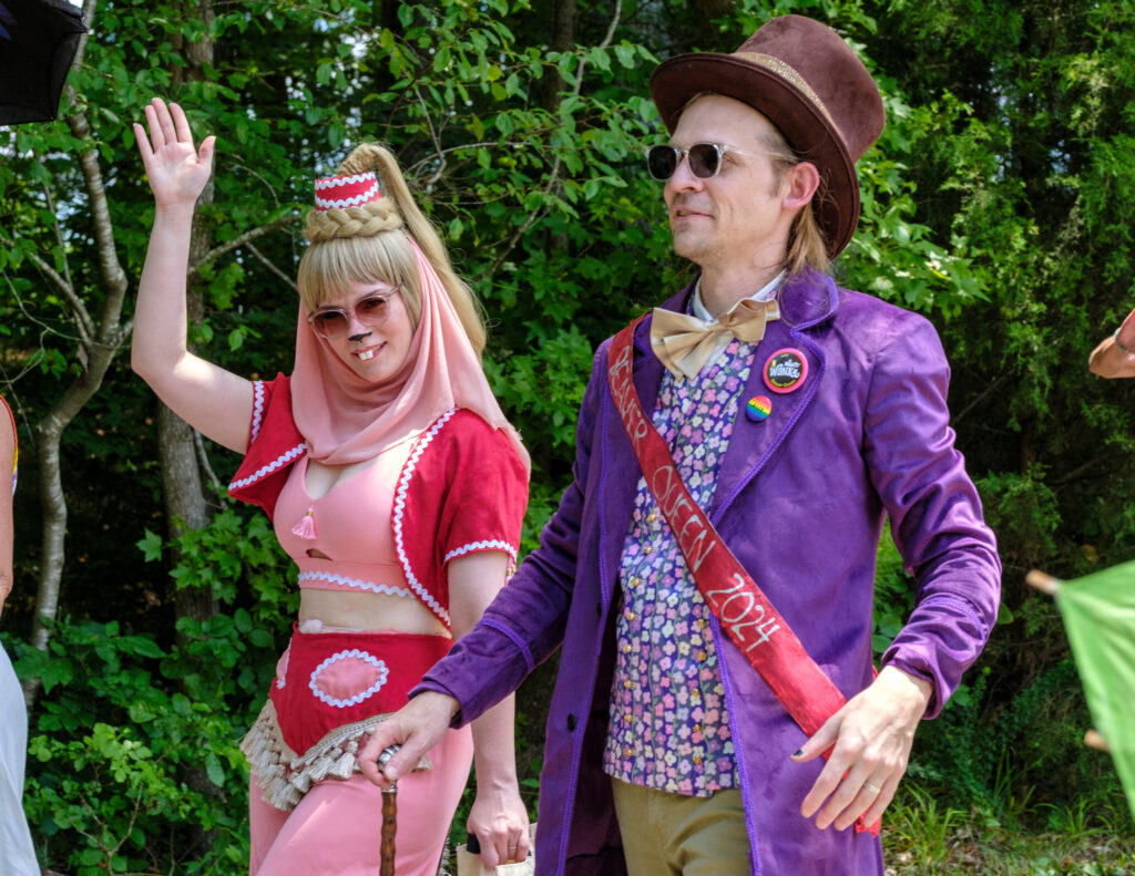 Beaver Queen Woody Wonka leads the parade, escorted by former Queen Jeannie Tailia.