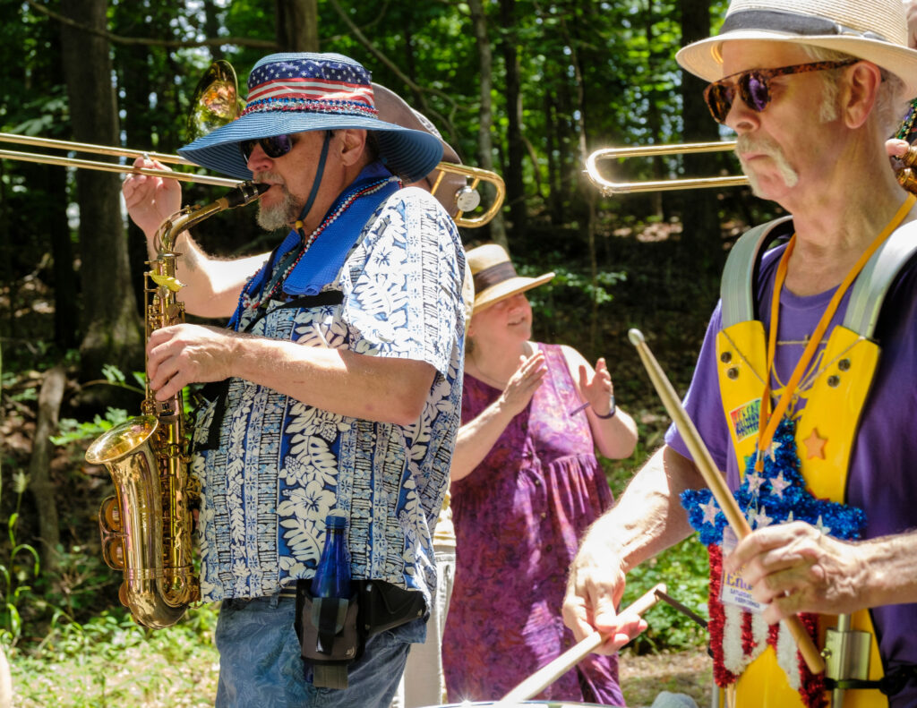 Eno Festival parade, close up on Paul (sax) and Fred (drums)