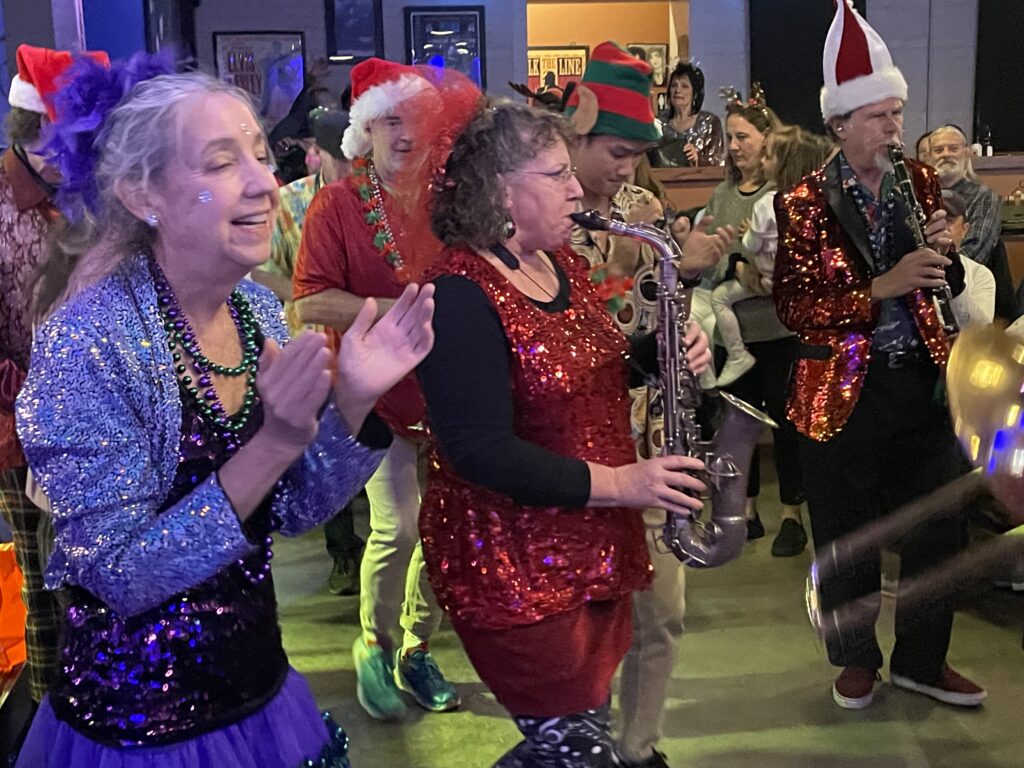 The band marching through the crowd to "Saints"